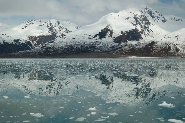 Mountains reflection in lake with snow