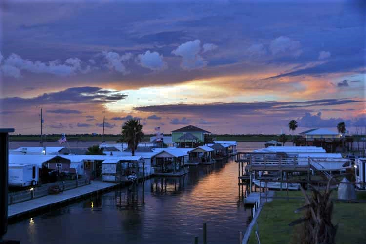 sunset over huts