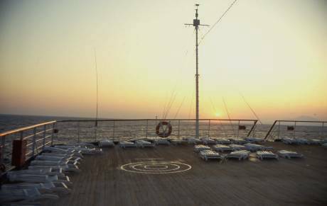 view of the sunset from ship's deck