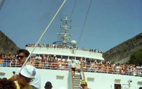 people watching journey through canal